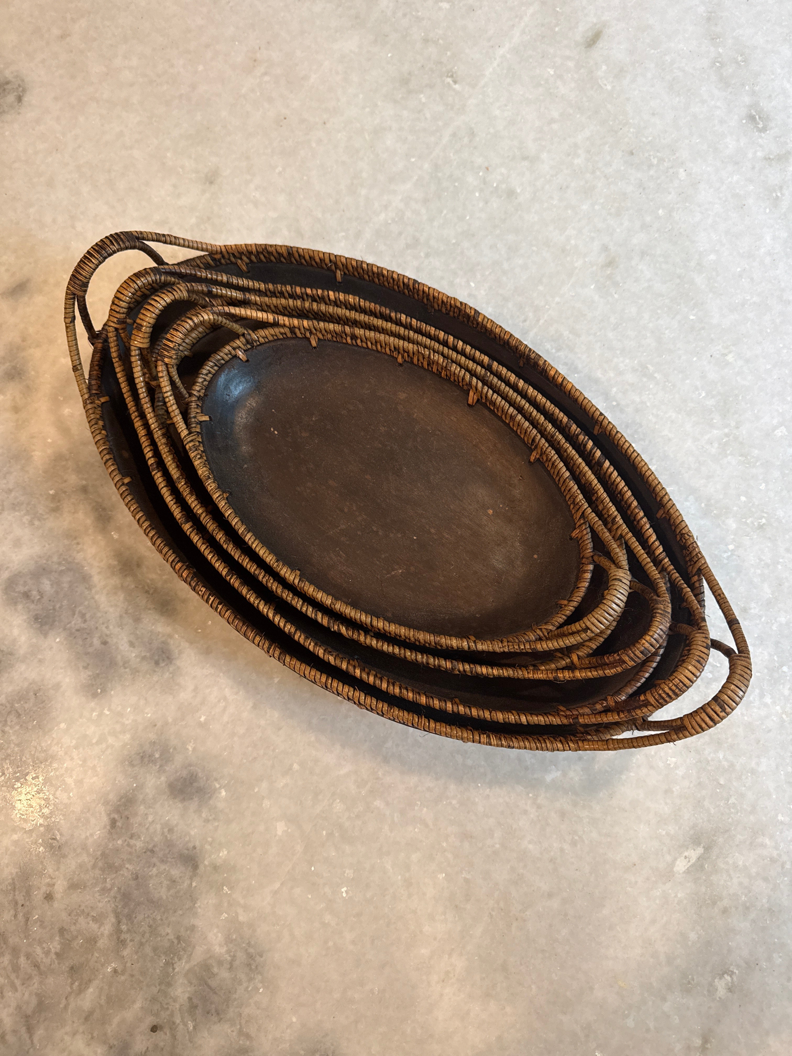 Set of four vintage wood and woven rattan nesting bowls