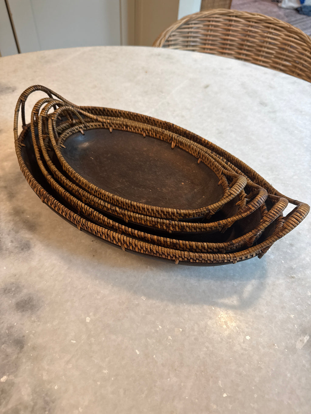 Set of four vintage wood and woven rattan nesting bowls