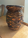 Vintage rattan wrapped clay vase